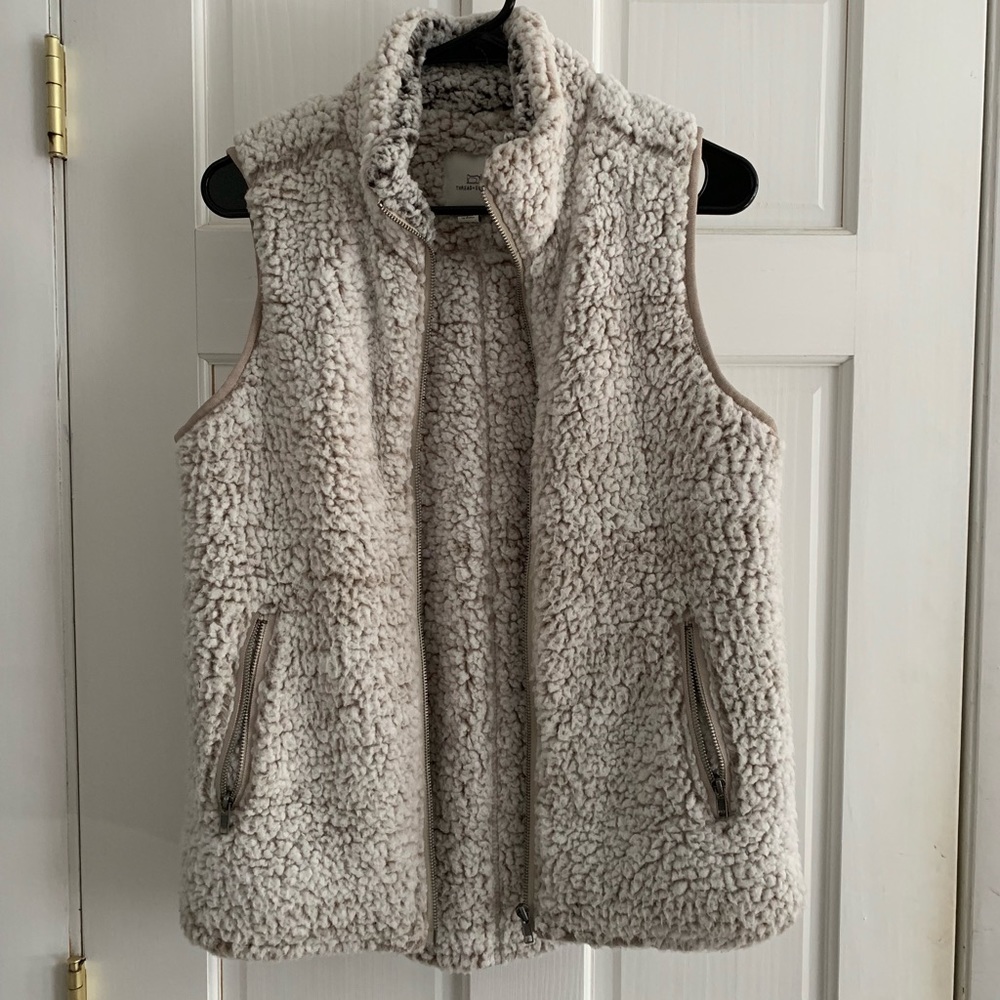 Furry vest with silver zippers